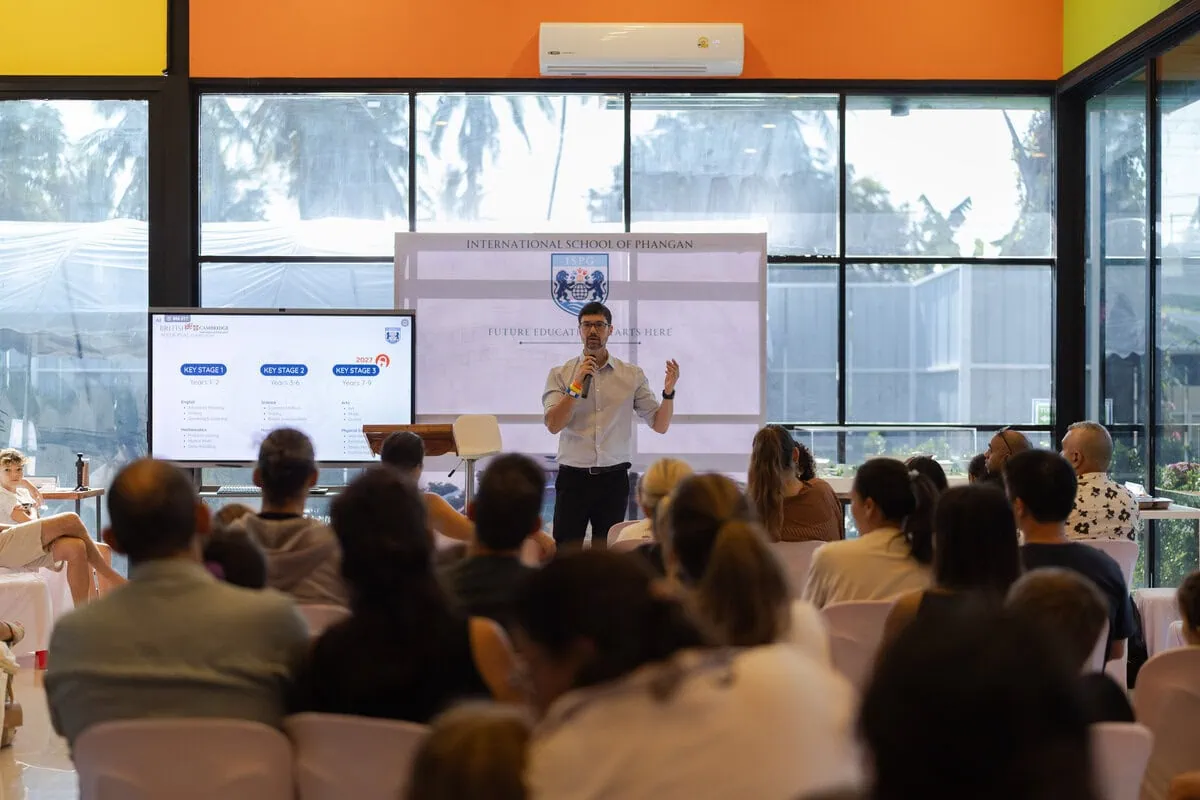 Parents listening to an ISPG curriculum presentation